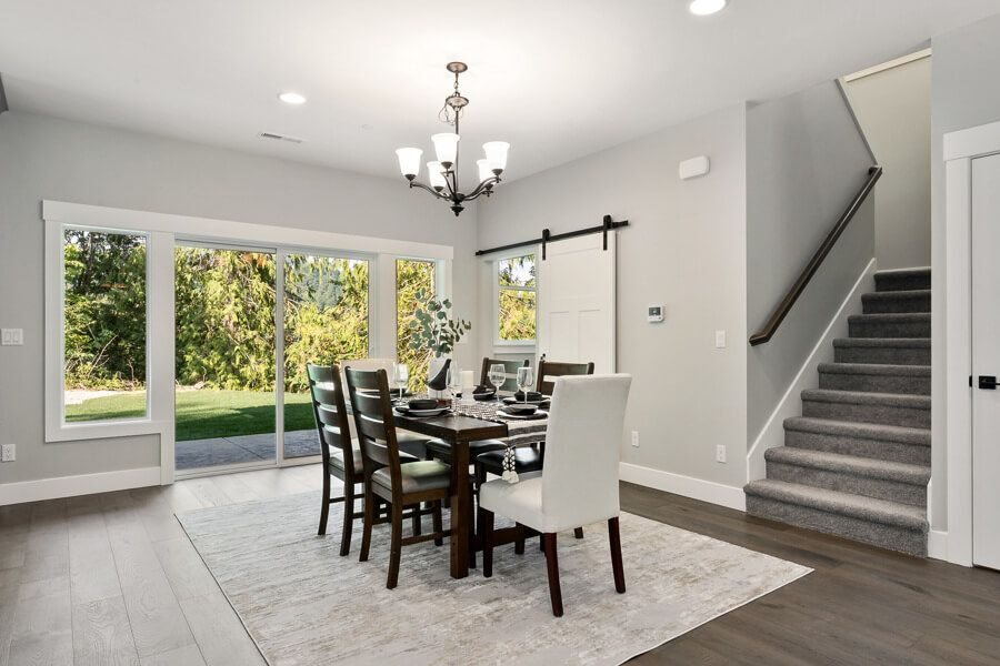Dining area beside a open-riser staircase